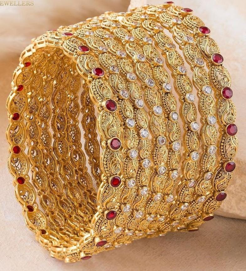Stack of matching gold bangles