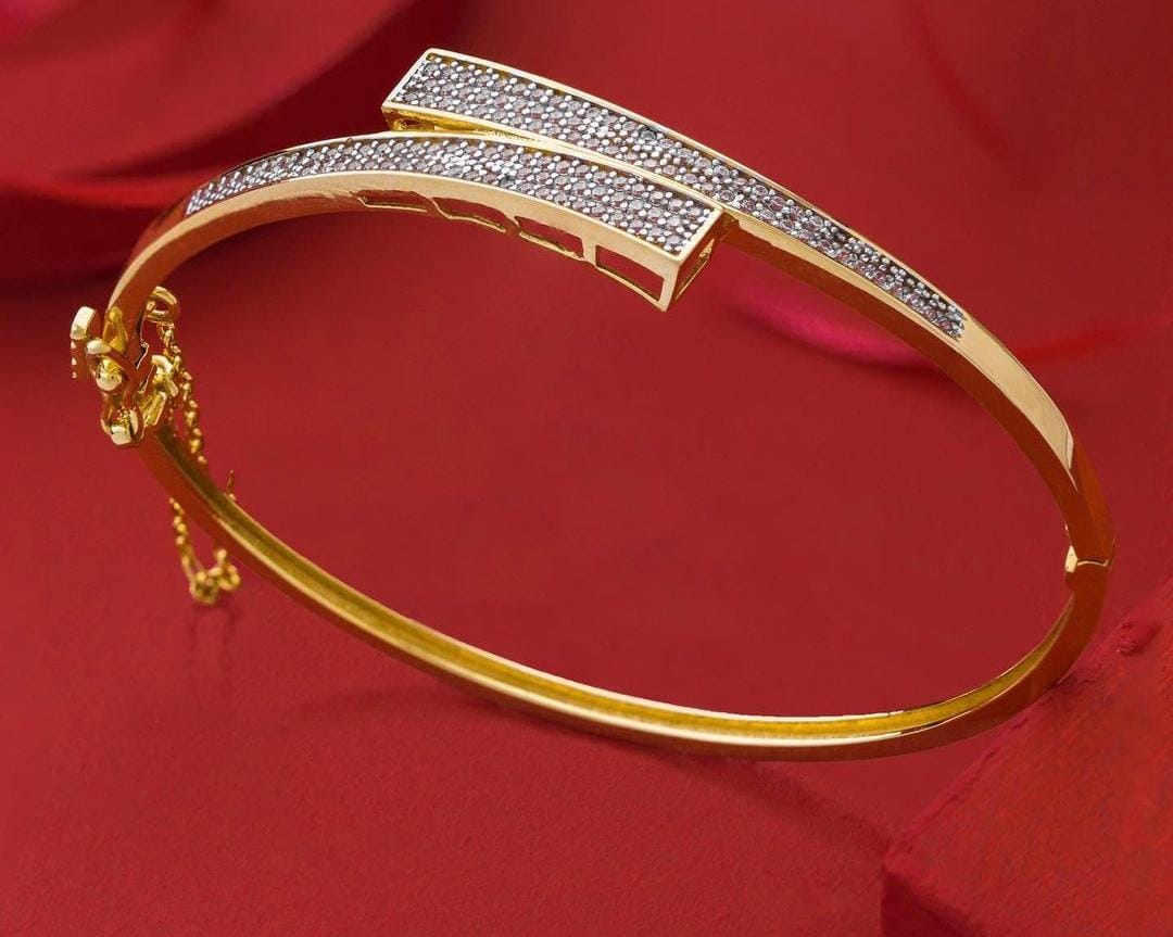 Gold cuff bracelet with detailed craftsmanship