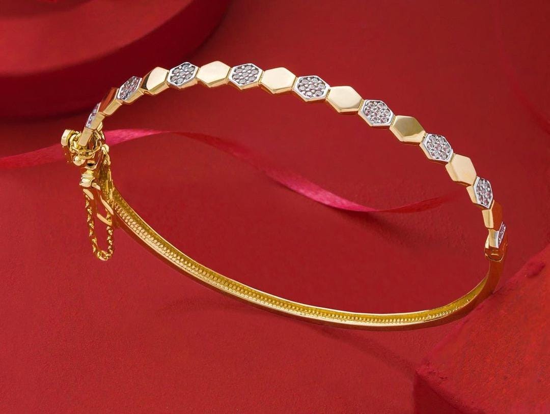 Filigree gold bangle with white gold accents