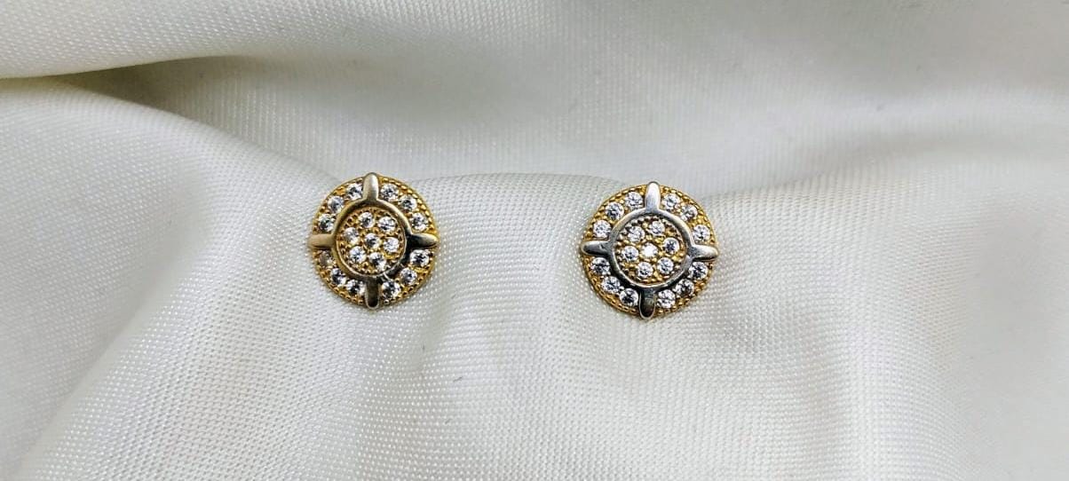 Small round gold studs with diamond pavé and white gold details