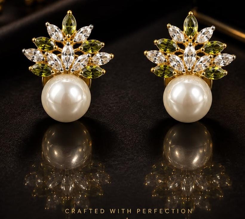 Pearl earrings with a gold leaf crown set with white and olive green marquise stones
