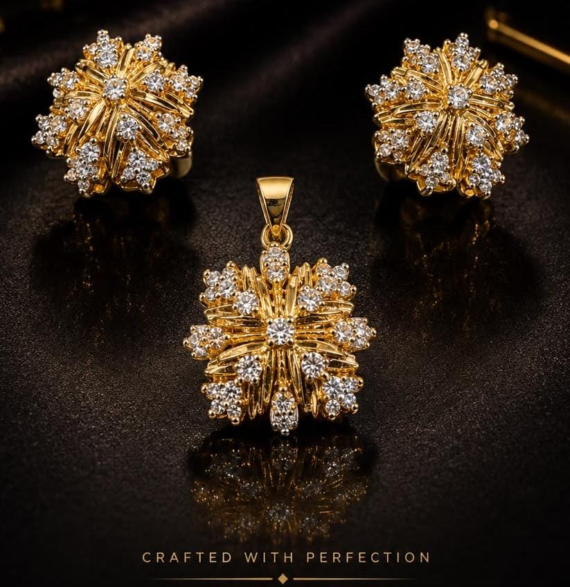 Gold starburst earrings and matching pendant set with diamonds