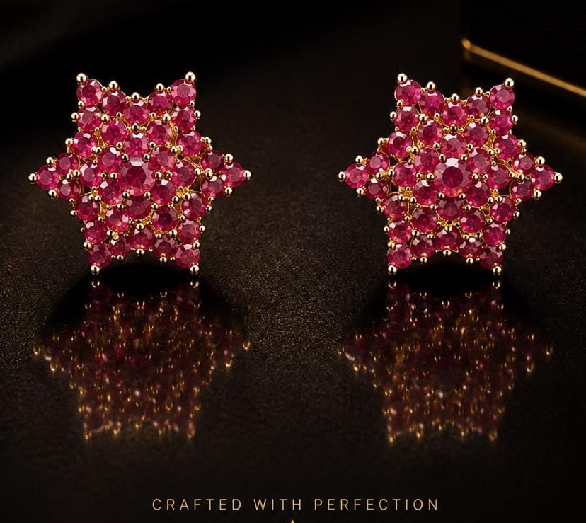 Starburst earrings set with round rubies